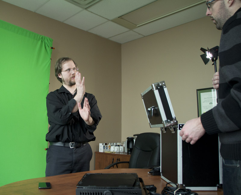 Scott directing green screen lighting.